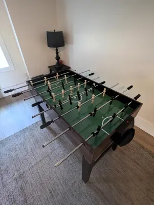 a foosball table in a room with at Swaying Pines Cabin w/EV Charger in South Bloomingville