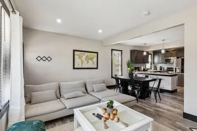 a living room with a couch and a table at Fairfax Urban Oasis - New Reno - 5 mins to Clinic in Cleveland