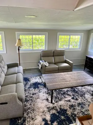 a living room with a couch and a coffee table at A Winfield Bungalow in Dover