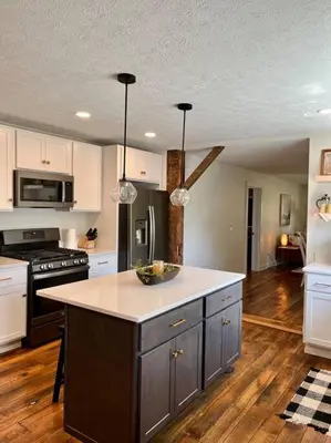 a kitchen with a island in the middle of it at A Winfield Bungalow in Dover