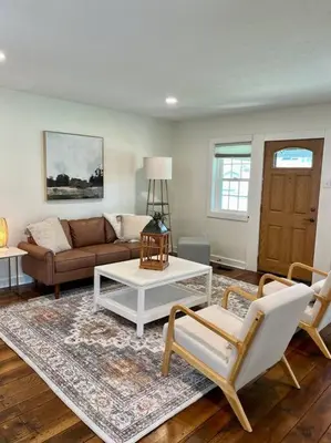 a living room with a couch and a coffee table at A Winfield Bungalow in Dover