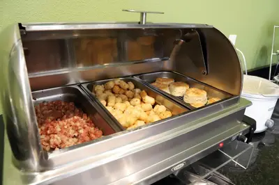 a buffet with many different types of food at Sleep Inn & Suites Belmont - St. Clairsville in Belmont