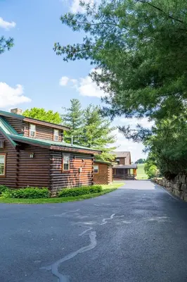a house on a road next to a building at Sage Brush Cabin in Millersburg