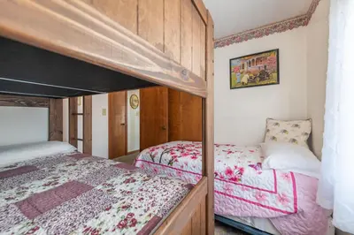 a bedroom with two bunk beds in a room at Sunset Cottage in Good Hope