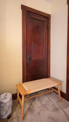 a wooden door and a bench in front of a door at Wayfarer Inn in Dalton