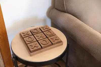a wooden block on a table next to a chair at Wayfarer Inn in Dalton