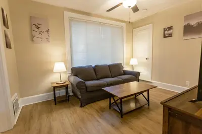 a living room with a couch and a table at Rolston 1 Bedroom House near Xavier, Downtown in Bellevue