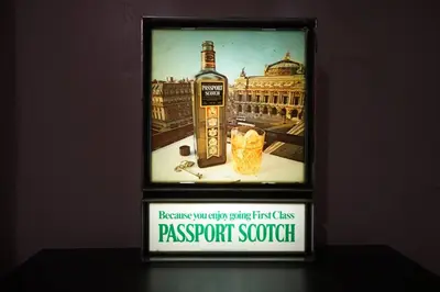 a picture of a bottle ofpressed scotch in a frame at Cute Charming Vintage Townhome in German Village in Columbus