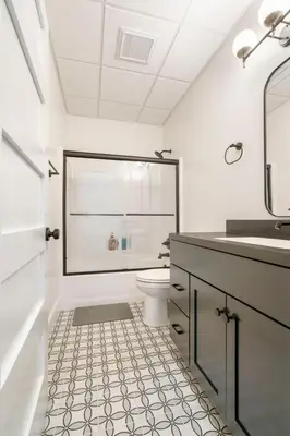 a white bathroom with a toilet and a sink at Young Suite in Millersburg