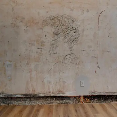 a drawing of a woman on a wall at Kaufman Suite- BY BUSY INTERSECTION in Millersburg