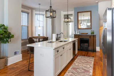 a kitchen with a sink and a counter top at Main Street 2BR, Walk to Bars, Stadiums, Downtown in Covington