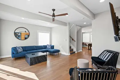 a living room with a blue couch and chairs at Clawfoot Tub, Next to Monastery Wedding Venue, 3BR in Cincinnati