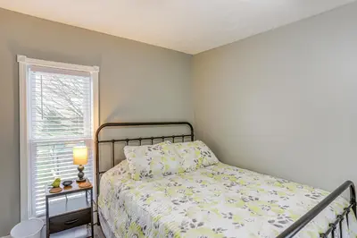 a bedroom with a bed and a window at Peaceful Shiloh Home with Deck and Fishing Pond Access in Shiloh