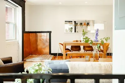 a living room with a table and a dining room at Lux Parkside 1BR - Patio - Sun Deck - Free Parking in Cincinnati