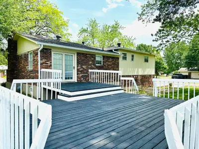 a wooden deck in front of a house at Sunshine Palace in West Chester