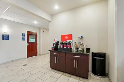 a waiting room with a counter in a hospital at Cobblestone Hotel & Suites - Russells Point at Indian Lake in Russells Point