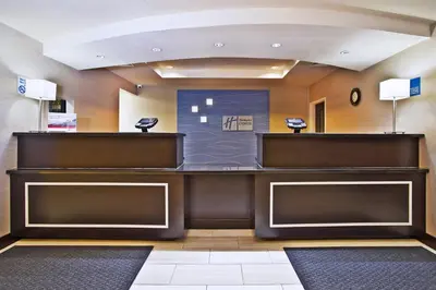 a lobby of a hospital with a reception desk at Holiday Inn Express & Suites Springfield by IHG in Springfield