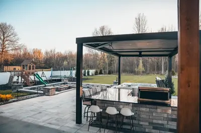 a pavilion with a kitchen and a playground at FeralWoods Private Estate With Hot Tub in Columbia Station