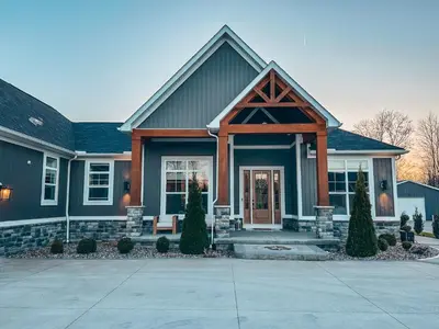 a large house with at FeralWoods Private Estate With Hot Tub in Columbia Station