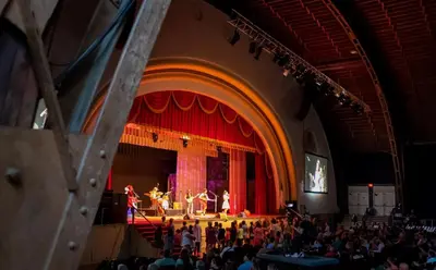 a group of people on a stage in an auditorium at The Fountain Inn in Lakeside