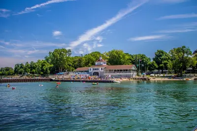 a large body of water with people on a beach at The Fountain Inn in Lakeside