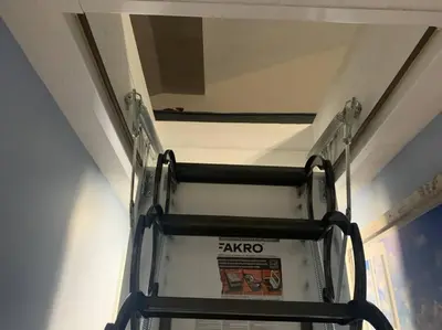 a ladder up to a bunk bed in a room at Rye Beach Retreat in Huron
