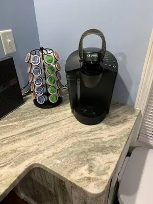 a counter with a toaster and a bag on it at Rye Beach Retreat in Huron
