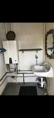 a small bathroom with a sink and a sink at Two Creeks Camp in Athens