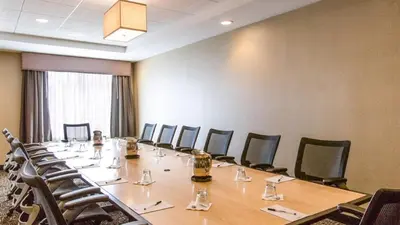 a large conference room with a long table and chairs at Wyndham Avon in Avon Center