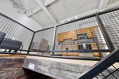 a cage with a bench in a building at 2125 Superior Living in Cleveland