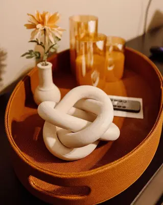 a wooden bowl with a rope on a table at Maple Heights Serenity Libby Unit 2 in Maple Heights