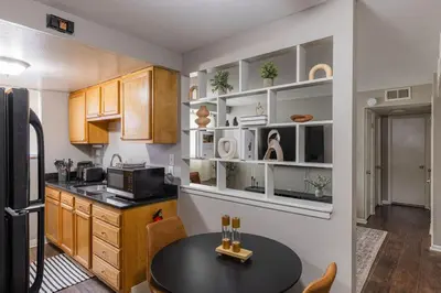 a kitchen with a table and a microwave at Maple Heights Serenity Libby Unit 2 in Maple Heights