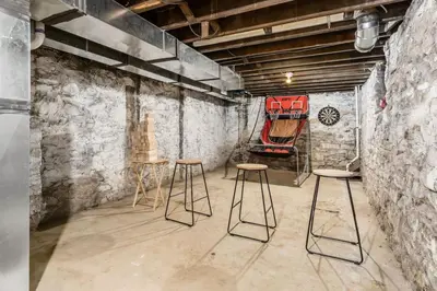 a room with three stools and a red chair at Entire Home Private Parking Fenced Yard in Columbus