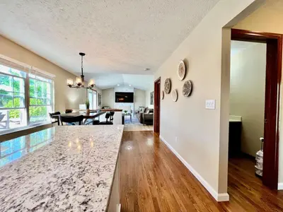a living room and dining room with a dining table at Suburban paradise in Liberty TWP in Hughes