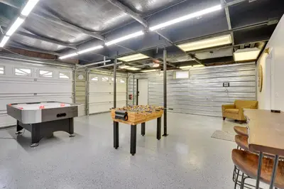 a garage with a pool table and a ping pong ball at Pet-Friendly Zanesville Haven with Game Room! in Zanesville