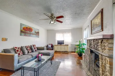 a living room with a couch and a fireplace at South Euclid Apt Less Than 10 Mi to Downtown Cleveland! in South Euclid