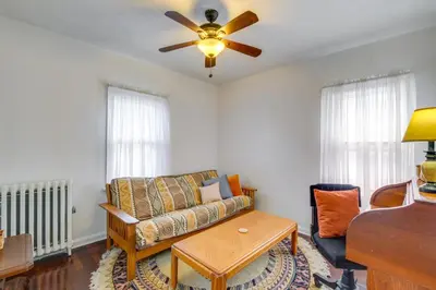 a living room with a couch and a ceiling fan at South Euclid Apt Less Than 10 Mi to Downtown Cleveland! in South Euclid