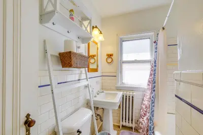 a small bathroom with a sink and a toilet at Trendy South Euclid Apt - 5 Mi to Cleveland Clinic in South Euclid
