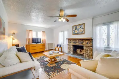 a living room with a couch and a fireplace at Trendy South Euclid Apt - 5 Mi to Cleveland Clinic in South Euclid