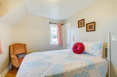 a bedroom with a bed with a red ball on it at Inviting Vacation Home 2 Mi to Mill Creek Falls! in Garfield Heights