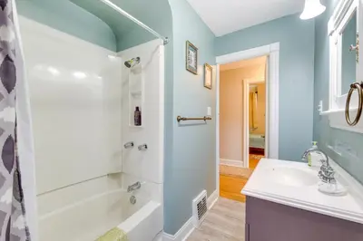a bathroom with a shower and a sink at Inviting Vacation Home 2 Mi to Mill Creek Falls! in Garfield Heights