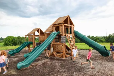 a group of children playing on a playground at Lodge 101 at Eden Reserve Near Ark in Williamstown