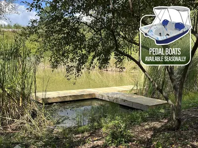 a sign for a pond with a boat on it at Lodge 101 at Eden Reserve Near Ark in Williamstown