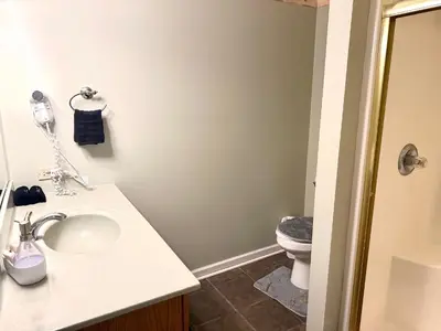 a bathroom with a sink and a toilet at Nice Home in Hudson in Hudson