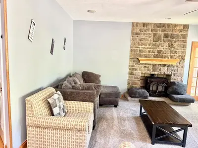 a living room with a couch and a fireplace at Nice Home in Hudson in Hudson