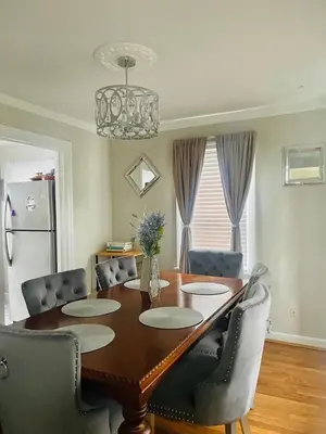 a dining room table with chairs and a refrigerator at Home in Anderson Township in Cincinnati