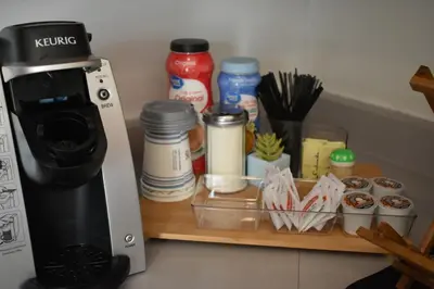 a coffee maker sitting on a shelf next to a counter at Downtown Lima 1 Bdrm Haven! in Lima