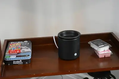 a coffee cup sitting on a table with a book at Downtown Lima 1 Bdrm Haven! in Lima