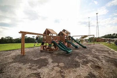 a park with a playground with a slide at Block of 4 Lodges at Eden Reserve - For Groups in Williamstown