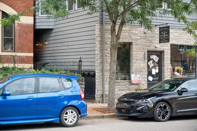 two cars parked in front of a house at 1BR Apt, Minutes to Downtown Cincy, Stadiums, Bars in Ludlow